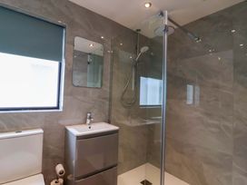 A bathroom with a shower and sink at Kernyk in Camelford