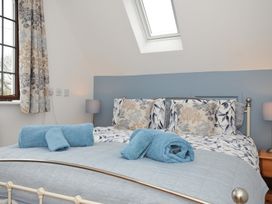 A bedroom with a bed and pillows at Kernyk in Camelford