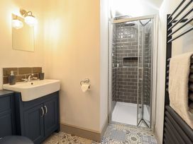 A bathroom with a sink and a shower at The Farmhouse in Oswestry