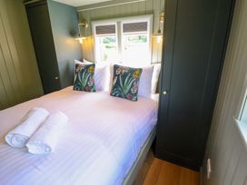 A bedroom with a bed and pillows at Bluebell in Grimsby