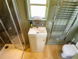 A bathroom with a shower, sink, and toilet at Primrose, Grimsby