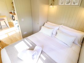 A bedroom with a bed and pillows at Magnolia in Grimsby