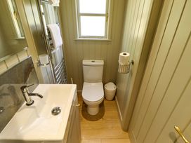 A bathroom with a sink and toilet at Magnolia in Grimsby