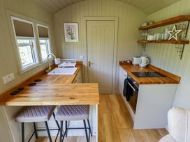 A kitchen with a sink and counter at Snowdrop in Grimsby