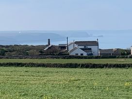 A view of houses and coastline from a field at Stargazy Skies near Beacon Drive near St Agnes