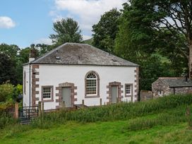 A building with a gray roof and windows at The School in Mungrisdale near Caldbeck