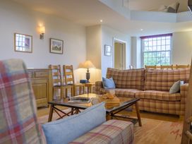 A living room with a sofa and coffee table at The School in Mungrisdale near Caldbeck