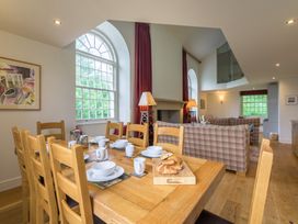 A dining room with a table set for breakfast at The School in Mungrisdale near Caldbeck