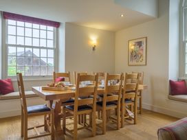 A dining room with a table set for breakfast at The School in Mungrisdale near Caldbeck