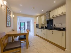 A kitchen with a table and chairs at The School in Mungrisdale near Caldbeck
