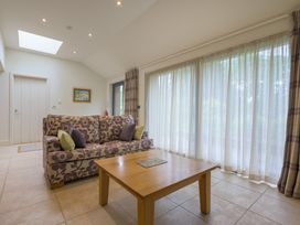 A living room with a sofa and coffee table at The School in Mungrisdale near Caldbeck