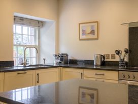 A kitchen with a sink and coffee machine at The School in Mungrisdale near Caldbeck
