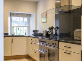 A kitchen with a sink, kettle, and coffee machine at The School in Mungrisdale near Caldbeck