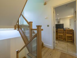 An entrance with a staircase and view of a kitchen at The School in Mungrisdale near Caldbeck