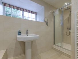 A bathroom featuring a shower and sink at The School in Mungrisdale near Caldbeck