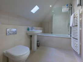 A bathroom with a sink, toilet and bathtub at The School in Mungrisdale near Caldbeck