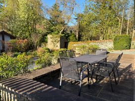 A garden with a table and chairs at The School at Mungrisdale near Keswick