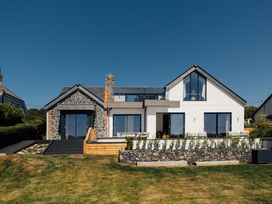 A house with stone features and large windows at Trevean in Mullion