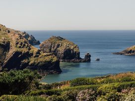 A scenic view of cliffs and ocean at Trevean in Mullion