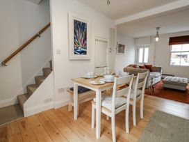A dining area with table and chairs at Fisherman’s Cottage