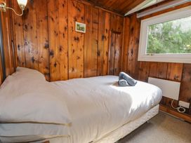 A bedroom with a bed and window at Ty Bedwen in Dinas Mawddwy