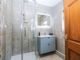 A bathroom with shower and sink at Tirionfa in Talsarnau