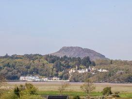 A mountain and town by the water at Tirionfa in Talsarnau