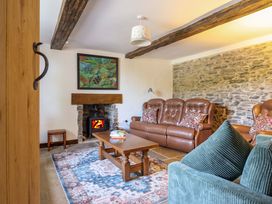 A living room with a sofa and coffee table at Upper Dolarddyn in Castle Caereinion