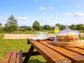 A table with cake and drinks at Upper Dolarddyn in Castle Caereinion
