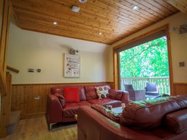 A living room with a sofa and window at Lodge 68 - Fern Gully near Chudleigh