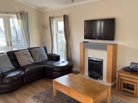 A living room with a sofa and coffee table at Woodland View 31 - The Hawthorns near Chudleigh