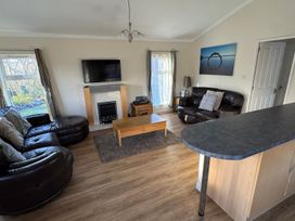 A living room with a sofa and coffee table at Woodland View 31 - The Hawthorns Finlakes Holiday Park near Chudleigh