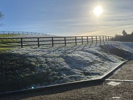 A hill with a fence and snow at Woodland View 31 - The Hawthorns Finlakes Holiday Park near Chudleigh