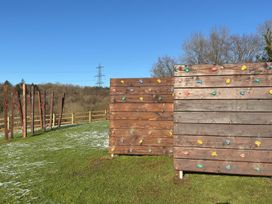 An outdoor climbing area with two climbing walls at Woodland View 31 - The Hawthorns Finlakes Holiday Park near Chudleigh