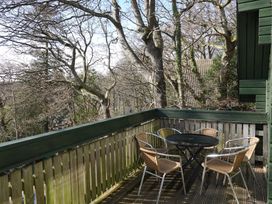 A balcony with table and chairs at Tor View Finlakes Holiday Park near Chudleigh