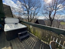 A hot tub on a deck at Tor View Finlakes Holiday Park near Chudleigh