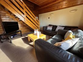A living room with a sofa and coffee table at Tor View Finlakes Holiday Park near Chudleigh