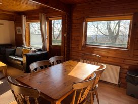 A dining room with a table and chairs at Tor View Finlakes Holiday Park near Chudleigh
