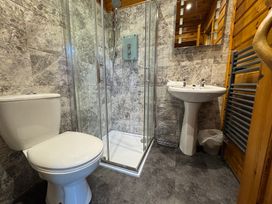 A bathroom with a shower and toilet at Tor View in Finlakes Holiday Park near Chudleigh