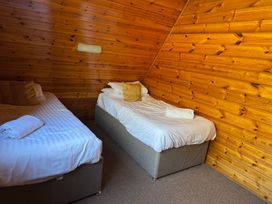 A bedroom with two beds at Tor View Finlakes Holiday Park near Chudleigh