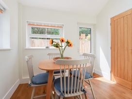 A dining room with a table and chairs at Glendale in Port Isaac