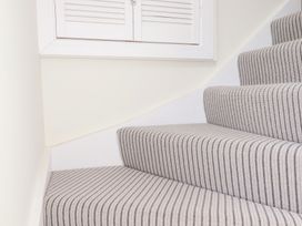 A staircase with a window at Glendale in Port Isaac