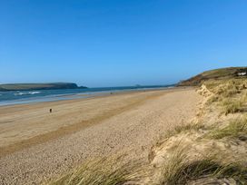 A beach with sand and water at Glendale Trelights near Port Isaac