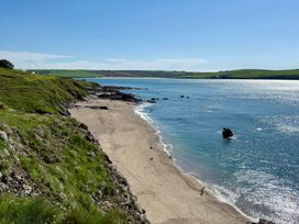 A beach with water and rocks at Glendale in Trelights near Port Isaac