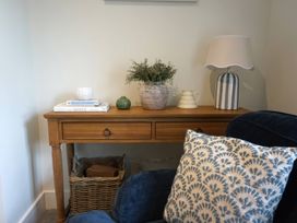 A living room with a table and lamp at Glendale near Trelights near Port Isaac