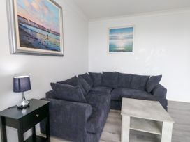 A living room with a sofa and coffee table at The View in Weymouth