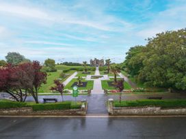 A garden with pathways and benches at The View in Weymouth