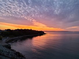 A sunset view over the water with clouds at The View in Weymouth
