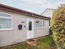 An exterior view of a house with a door and window at Golygfa Pandy Tudur near Llanrwst