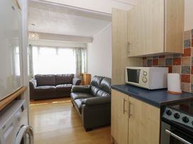 A kitchen area with a sofa and appliances at 440 California Sands